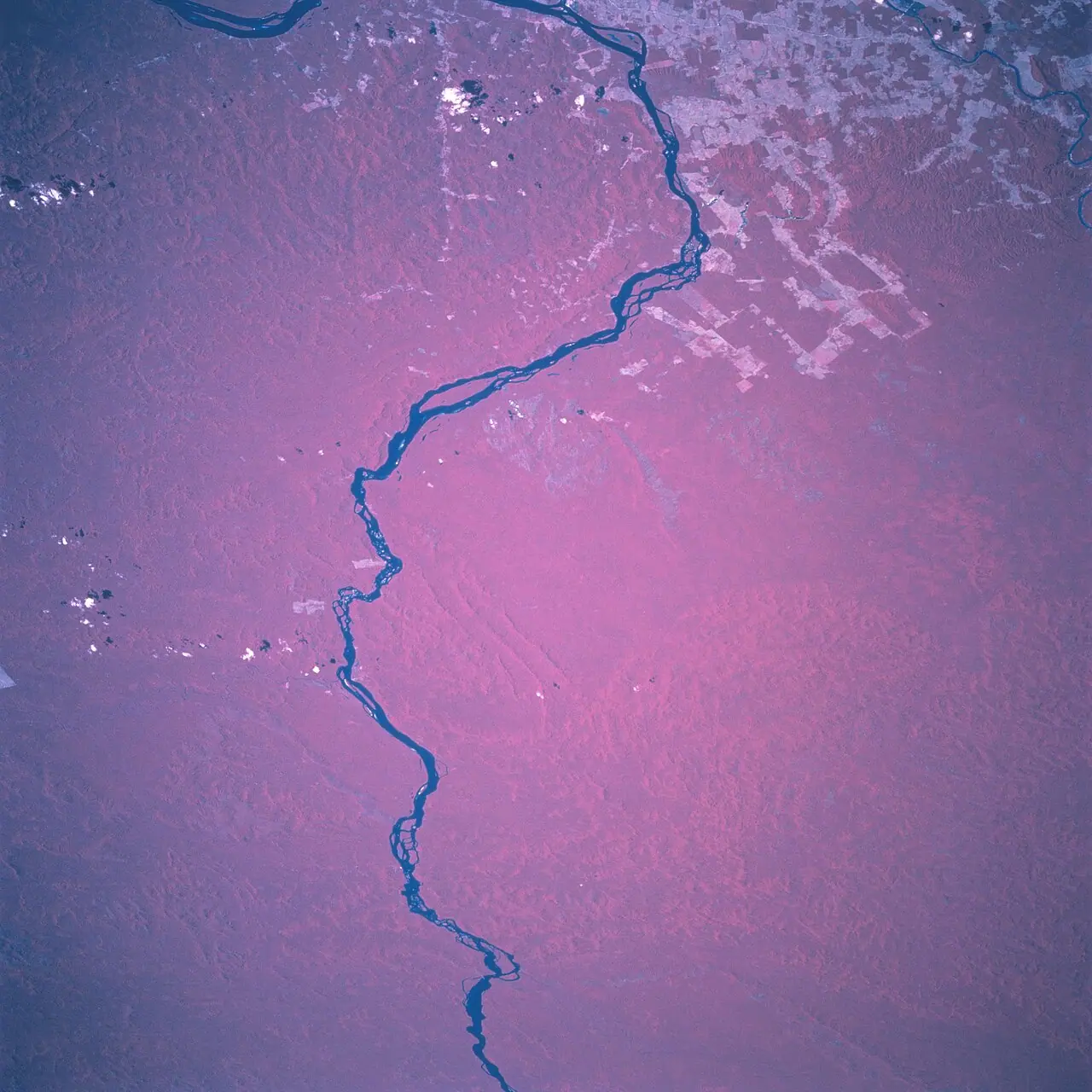 Xingu River basin in Brazil (Wikimedia Commons file Rio_Xingu.jpg—NASA Earth observation, STS-094)—regional geography for Volta Grande licensing fights; not a Belo Sun mine photo, tailings facility, or courtroom exhibit.