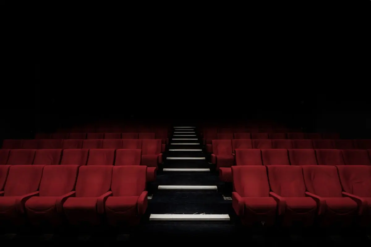 An empty cinema theater, reflecting the heavy atmosphere surrounding the new allegations in the French entertainment industry.
