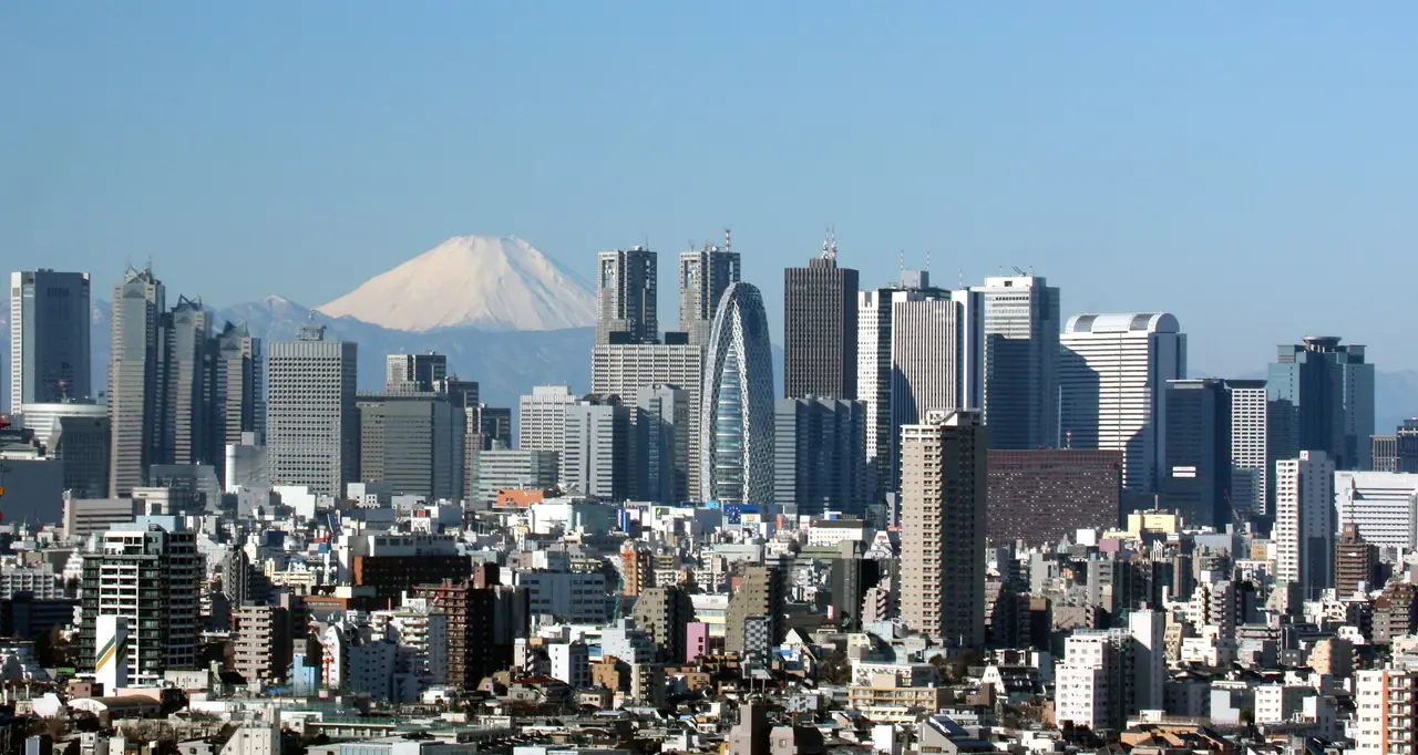 A panoramic view of the Shinjuku skyline in Tokyo, Japan, representing the urban setting of the new Forza Horizon 6.
