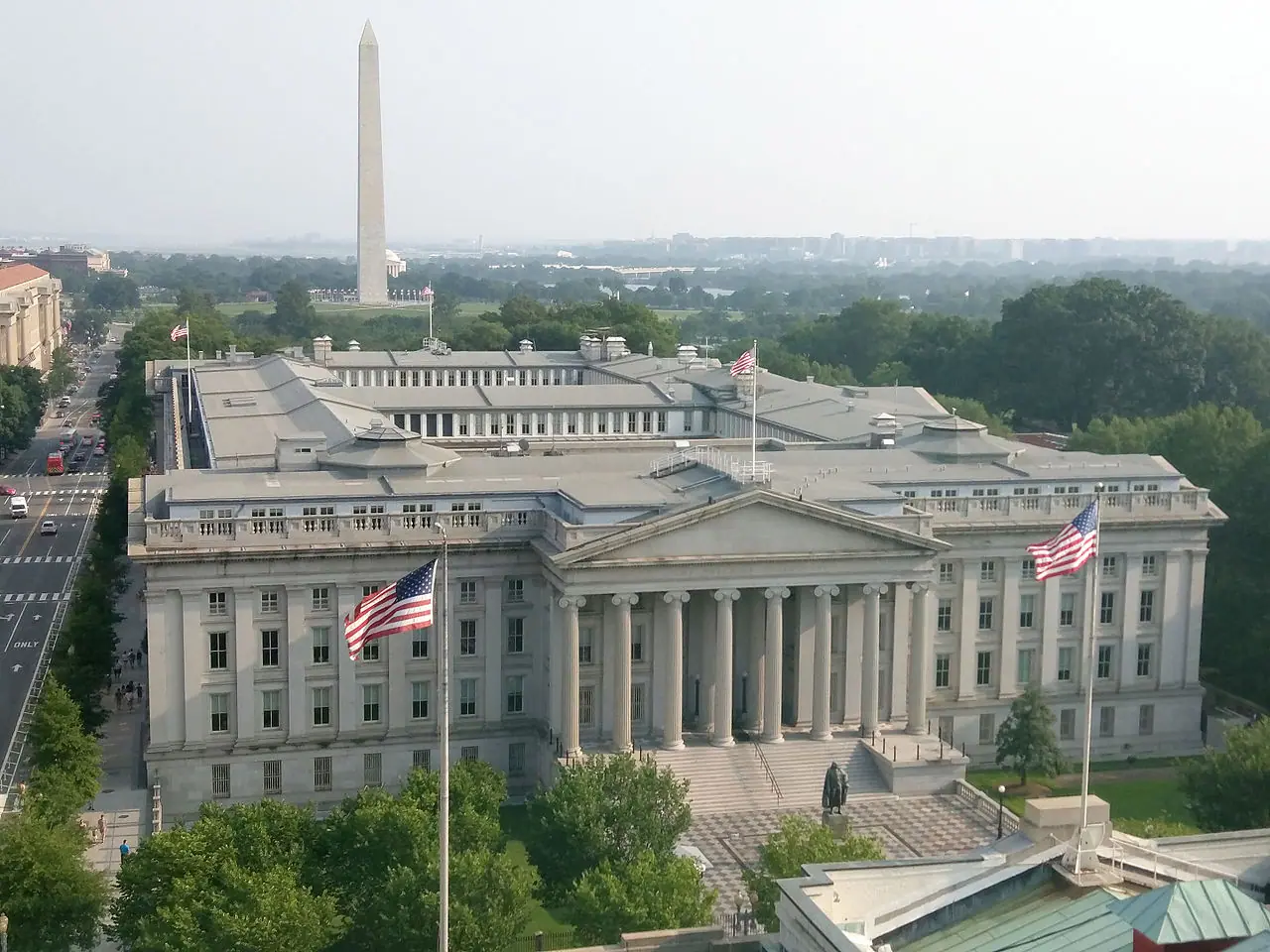 East façade of the US Treasury Building on Pennsylvania Avenue, Washington, D.C., July 2015 (Wikimedia Commons photograph by MeanieHyaena, CC BY 4.0)—federal enforcement geography for Treasury and OFAC coverage; not a courtroom exhibit, SEC filing stamp, or portrait of any Adani executive.