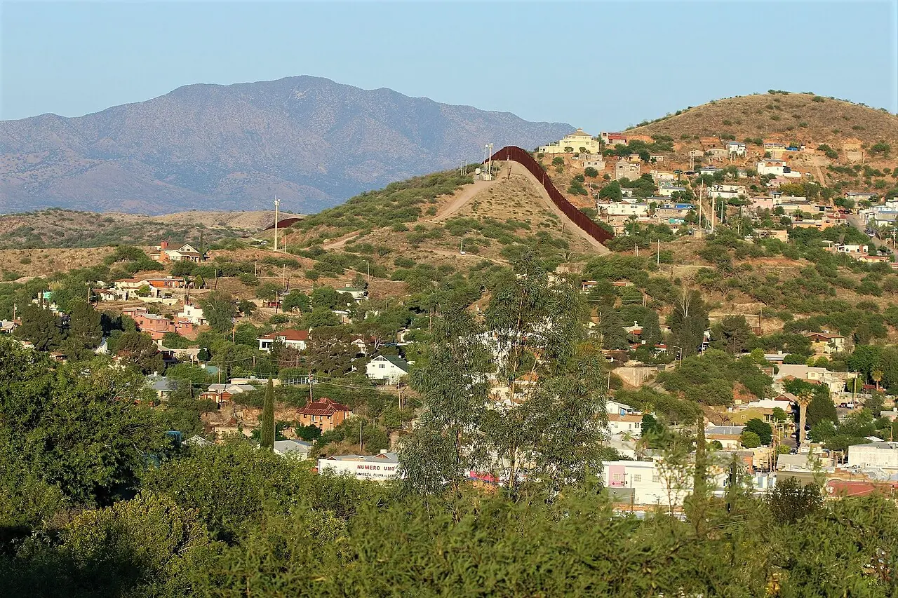 Aerial view of Nogales, Arizona, and Nogales, Sonora (Wikimedia Commons)—geographic context for the port-of-entry corridor named in press accounts, not a law-enforcement booking photo.