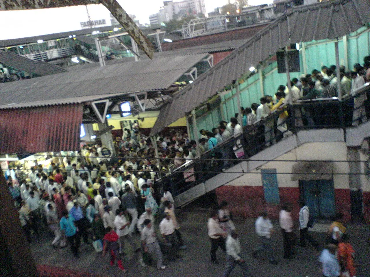 Crowd on suburban railway platforms in Mumbai—Wikimedia Commons photograph illustrating urban density and commuter volume, not a census count or any single policy programme named in the article.