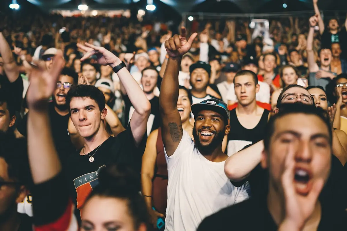 A large crowd at a live music performance, representing Tayler Holder's cancelled tour.