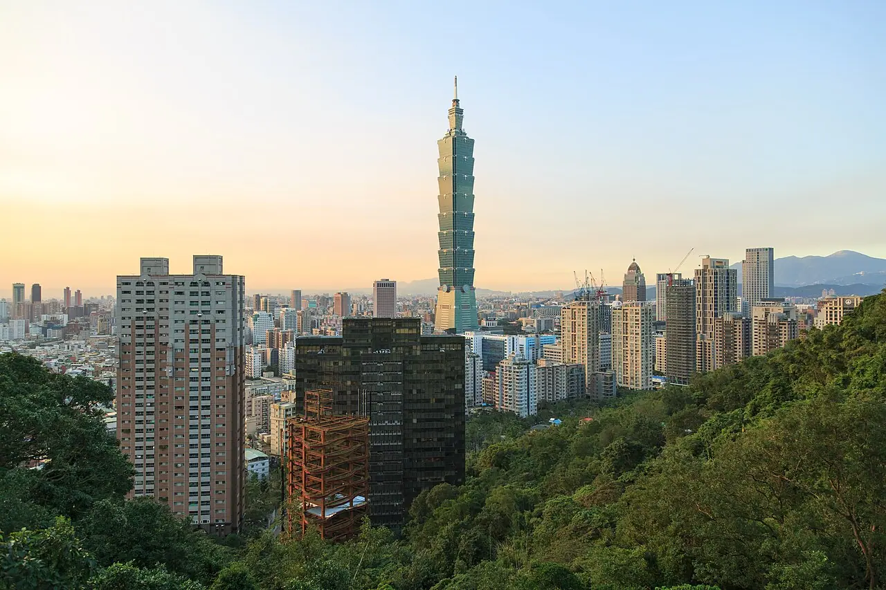 Twilight view of Taipei’s skyline with Taipei 101—Wikimedia Commons photograph of Taiwan’s largest metro area; geography referenced in cross-strait security reporting, not a military installation or classified site.