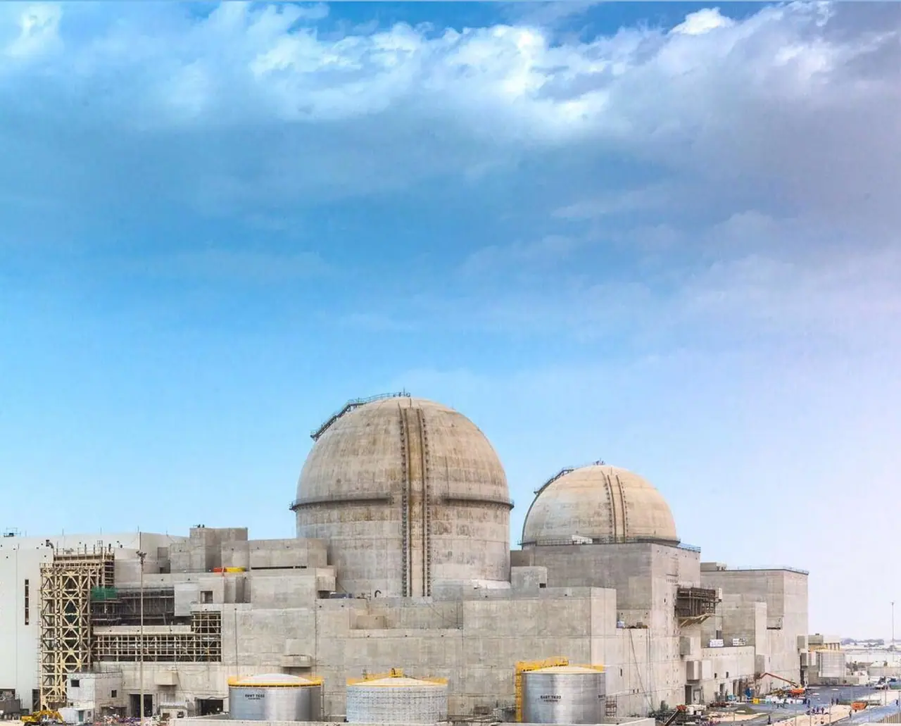Barakah nuclear power plant in Abu Dhabi's Al Dhafra region, showing reactor containment buildings and support structures (Wikimedia Commons file photo). It does not depict the May 2026 drone strike, emergency response, or damage to the perimeter electrical generator.