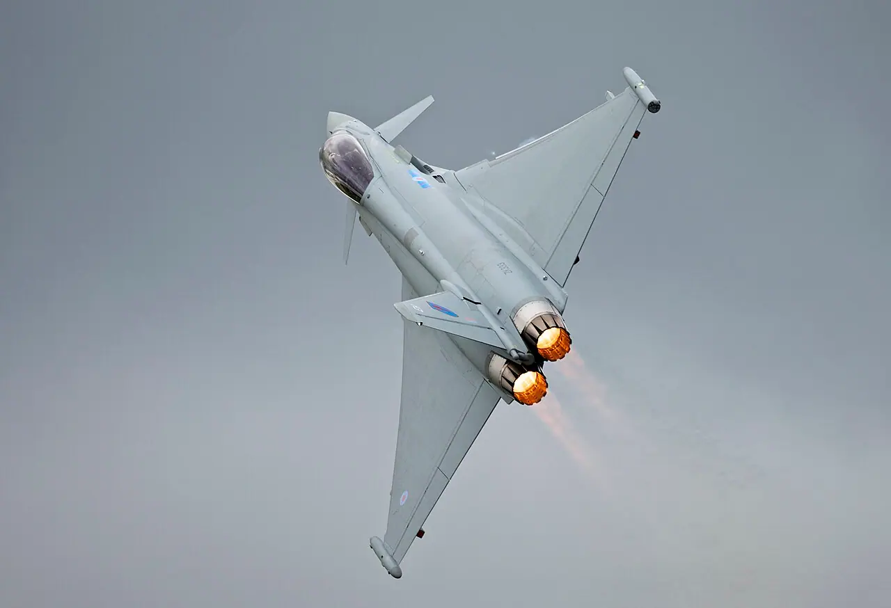 RAF Eurofighter Typhoon at Royal International Air Tattoo 2012 (Wikimedia Commons, Peter Gronemann, CC BY 2.0)—illustrates the fast-jet class now cleared to carry APKWS in regional operations; not a photograph of a specific May 2026 mission loadout or classified cockpit display.